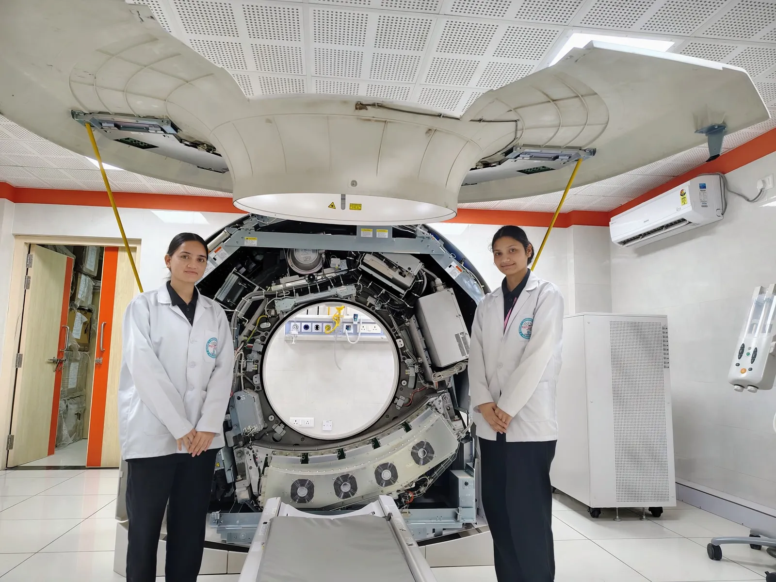 BMRIT students beside the CT gantry